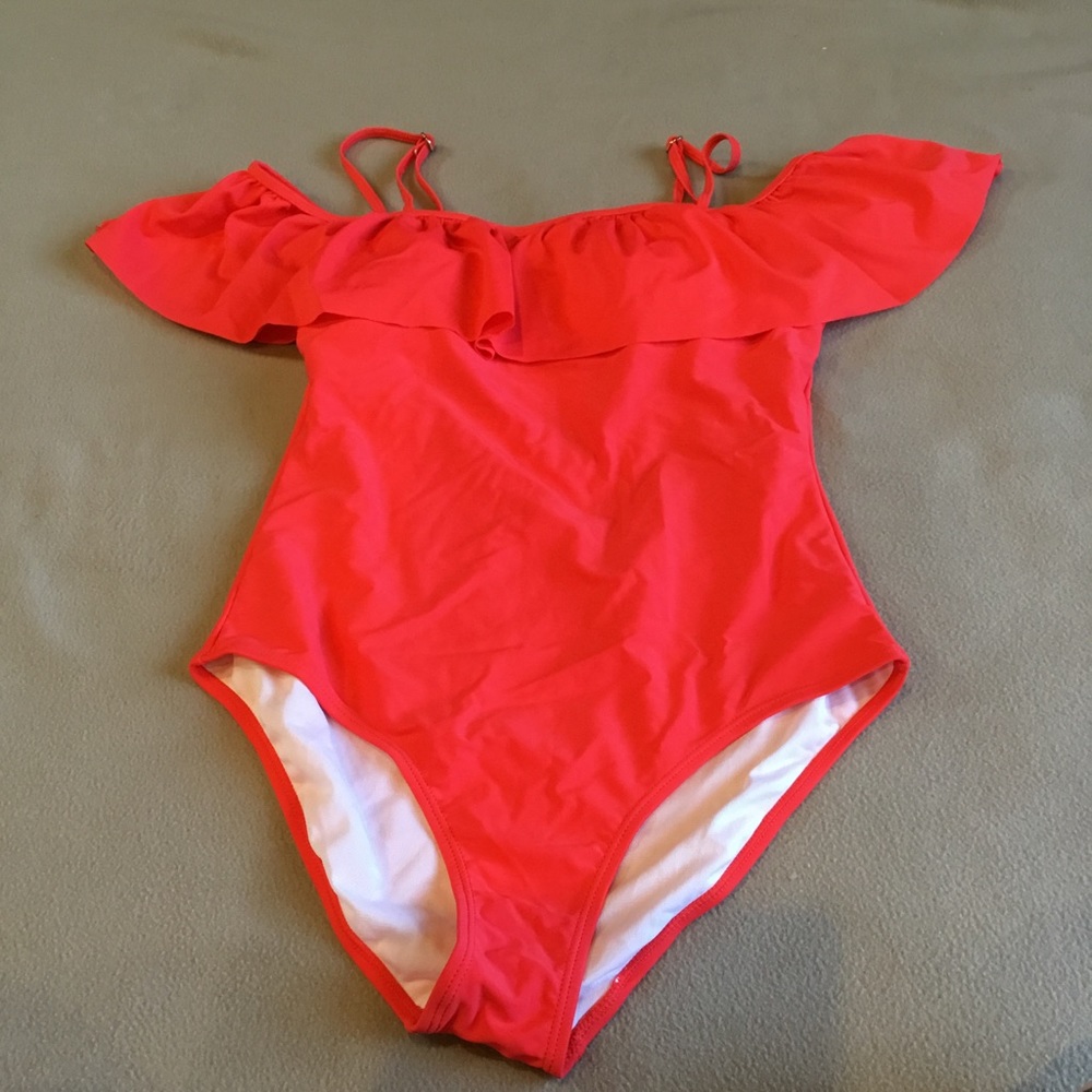 Woman’s coral red swimsuit